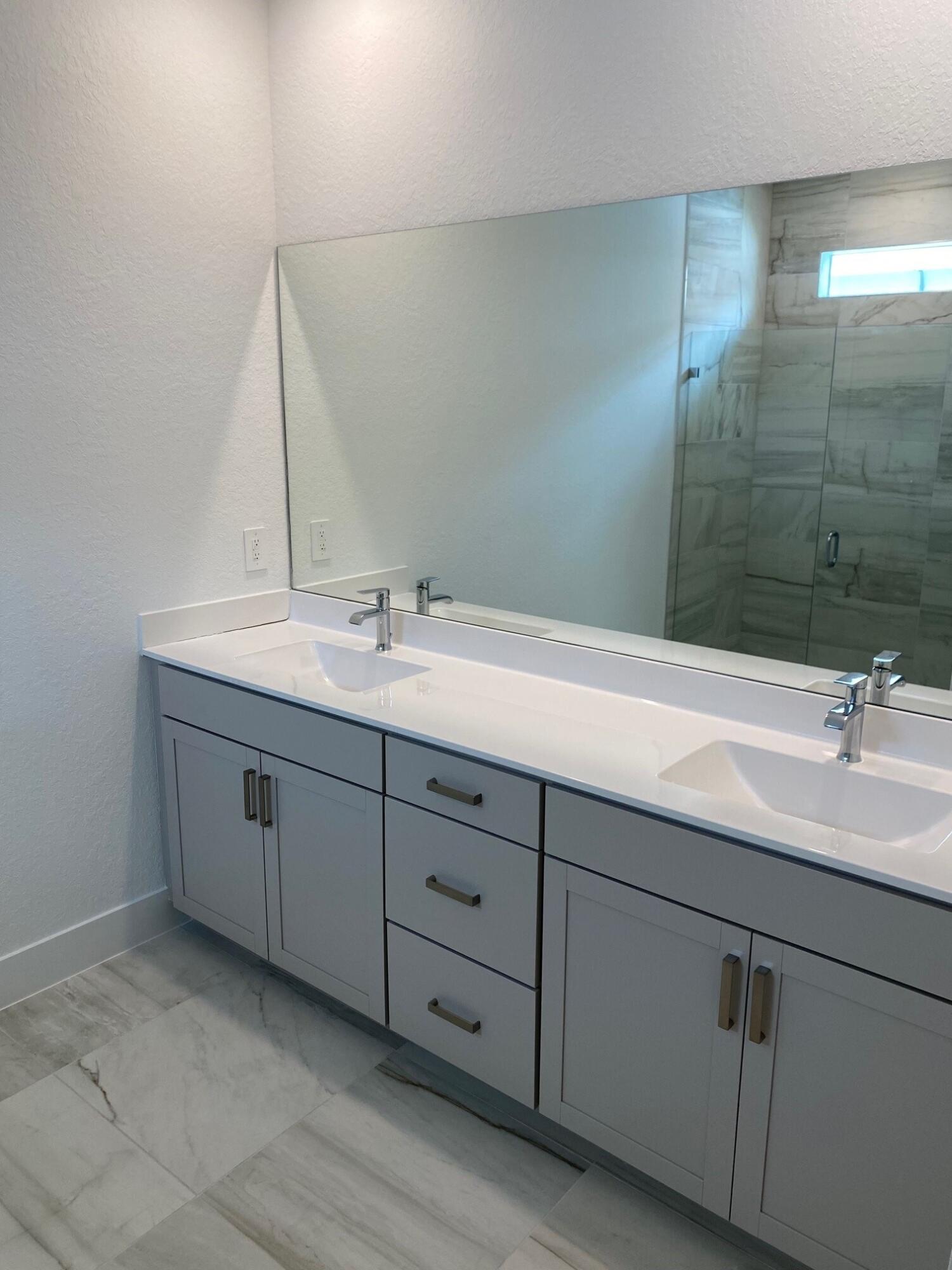 7100 Southeast Park Trace Stuart, FL 34997 - Photo 9 of 15 PPT 29 primary bath vanity