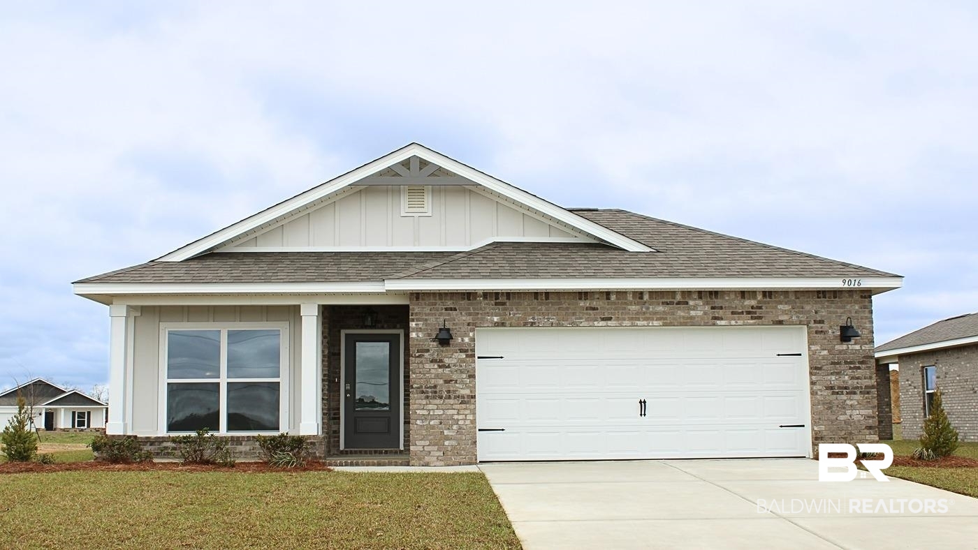 9016 Chabo Circle Foley, AL 36535 - Photo 1 of 35 View of front of house with a garage and a front lawn