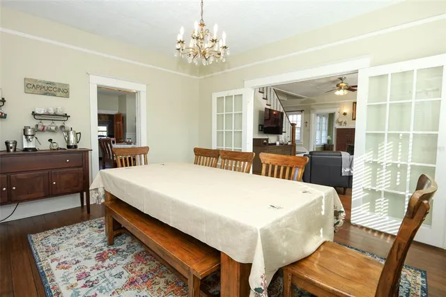 a view of a house with a yard and sitting area