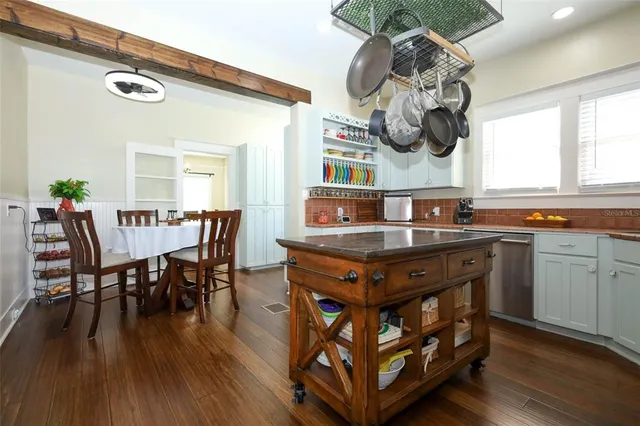 an aerial view of a house with swimming pool garden and patio