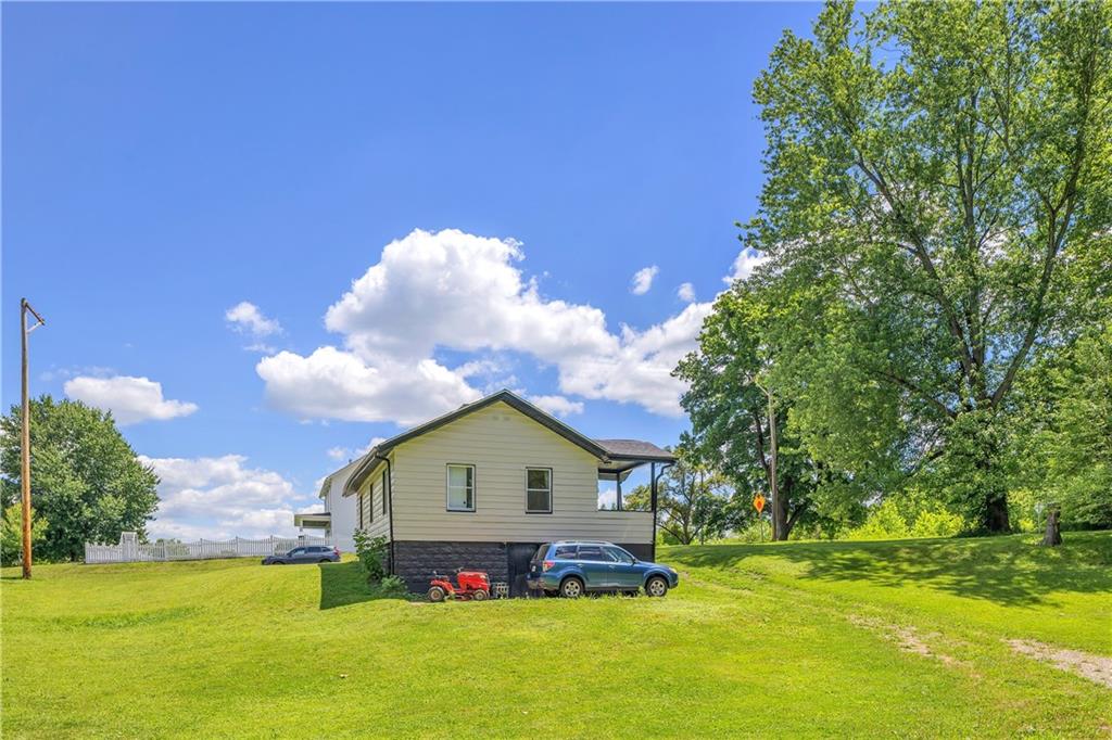 1747 Galilee Road Wampum, PA 16157 - Photo 29 of 32 The wide, natural landscape gives the home a serene backdrop in every season.