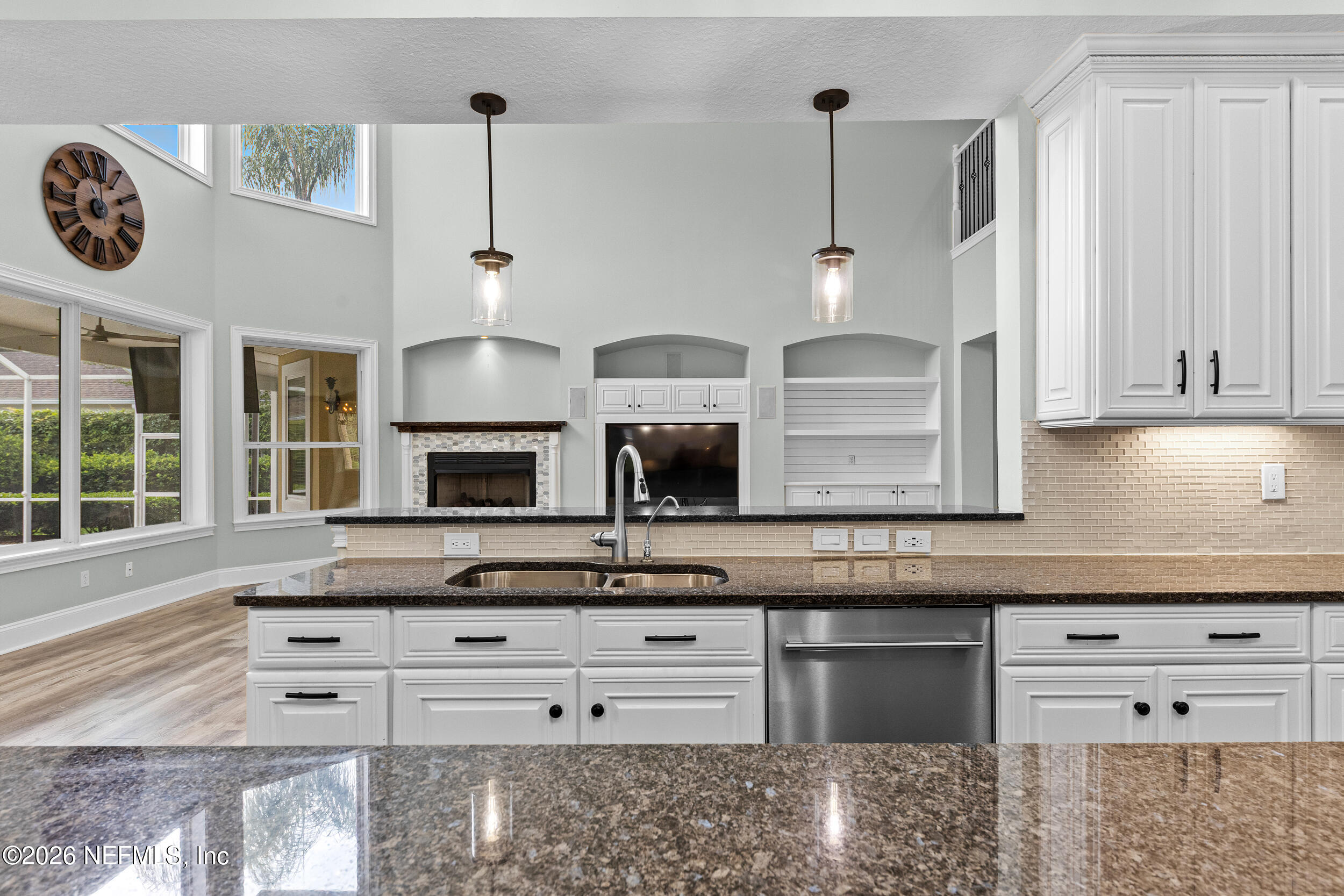 3225 Bishop Estates Road St. Johns, FL 32259 - Photo 20 of 90 a kitchen with stainless steel appliances granite countertop a stove and white cabinets