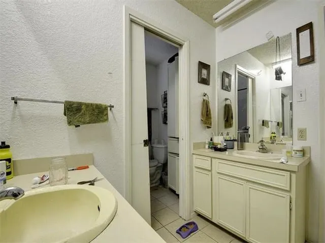 a bathroom with a sink and mirror