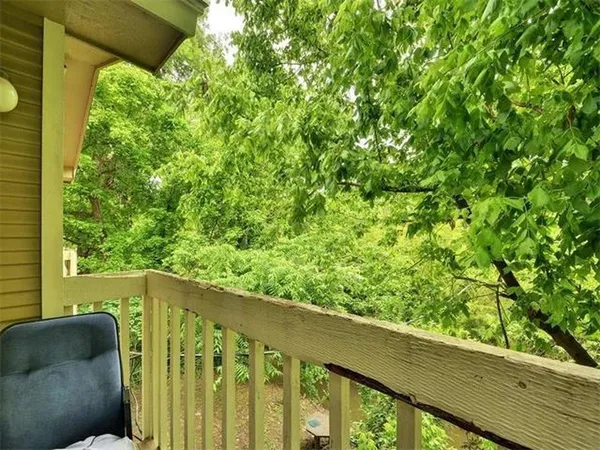 a view of balcony with furniture