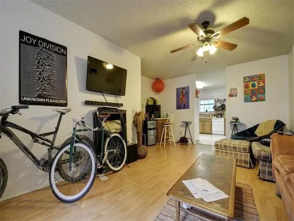 a view of a livingroom with furniture and a flat screen tv