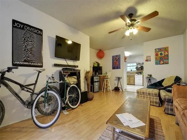 a view of a livingroom with furniture and a flat screen tv