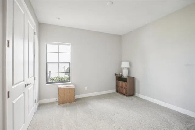 a bathroom with a granite countertop sink a toilet and a mirror