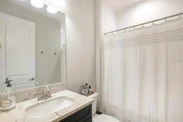 a living room with furniture a rug and a window