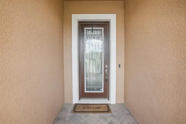 a view of a hallway with wooden door