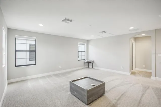 a view of an house with backyard space and balcony