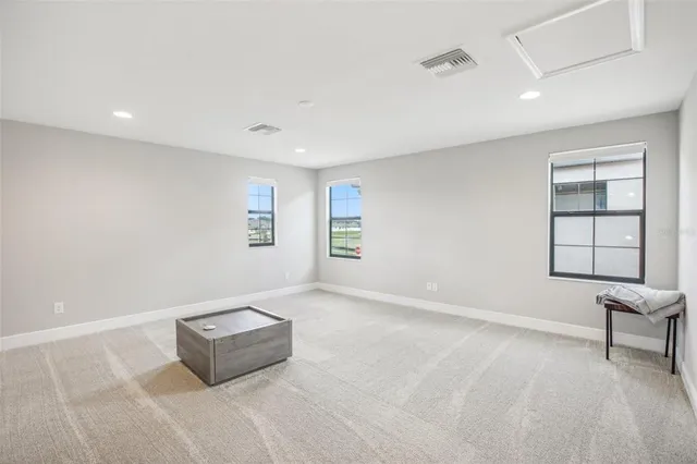 a view of a house with backyard and garden