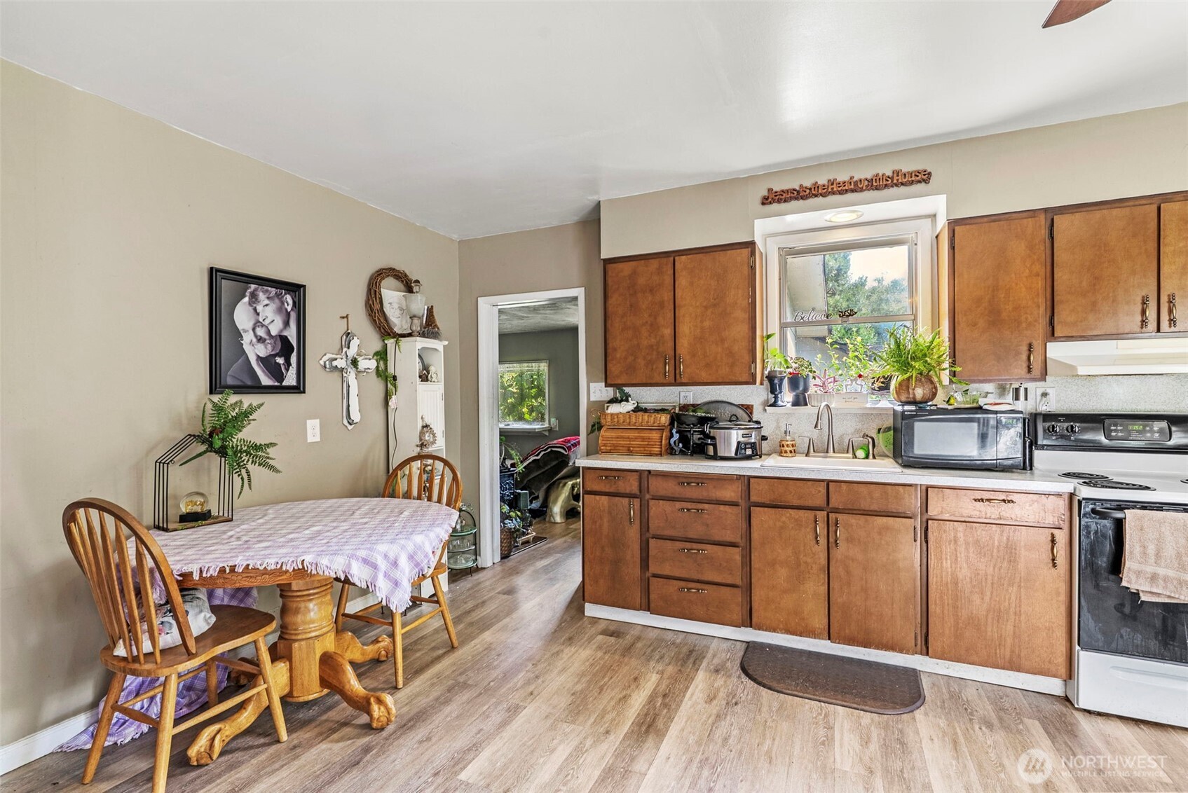 110 Madison Street Ryderwood, WA 98581 - Photo 12 of 30 a large kitchen with stainless steel appliances granite countertop a stove a sink a dining table and chairs