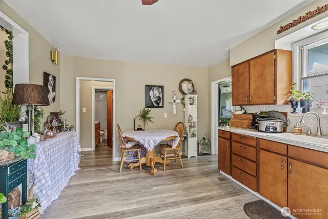 a living room with furniture a flat screen tv and a table