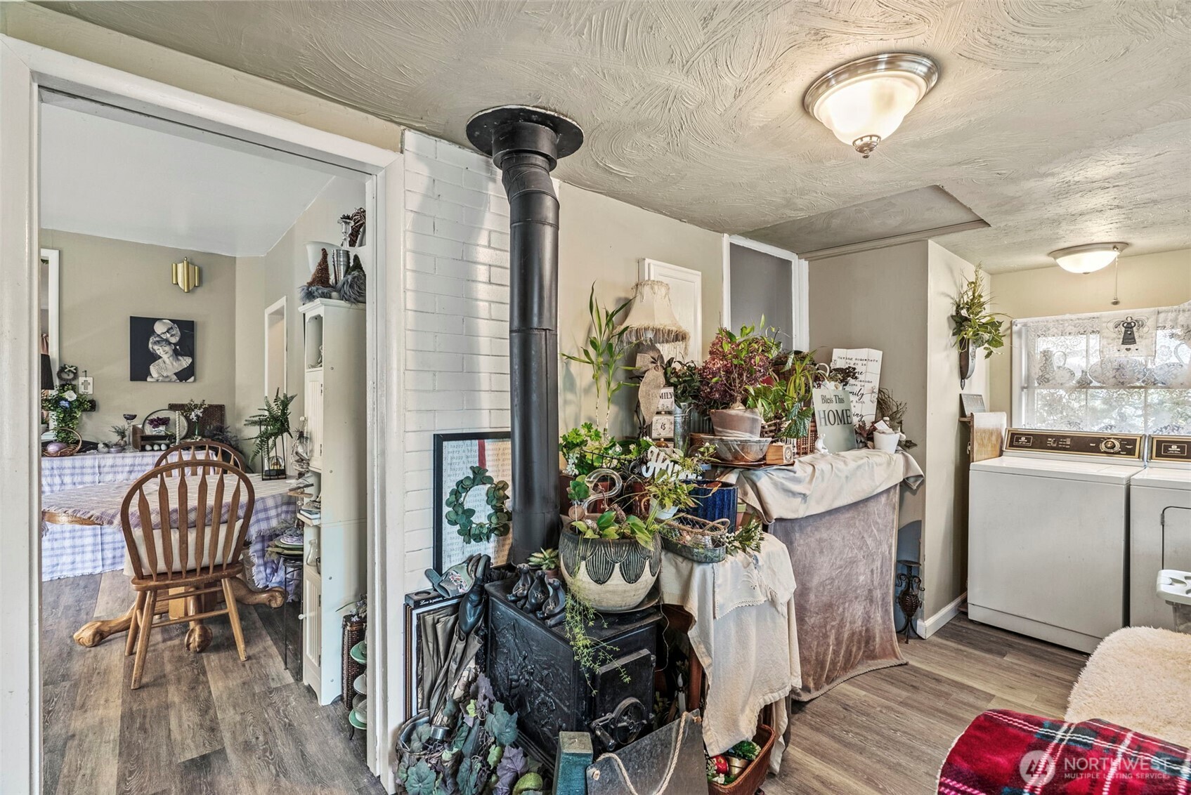 110 Madison Street Ryderwood, WA 98581 - Photo 16 of 30 a view of a dining room with furniture window and wooden floor