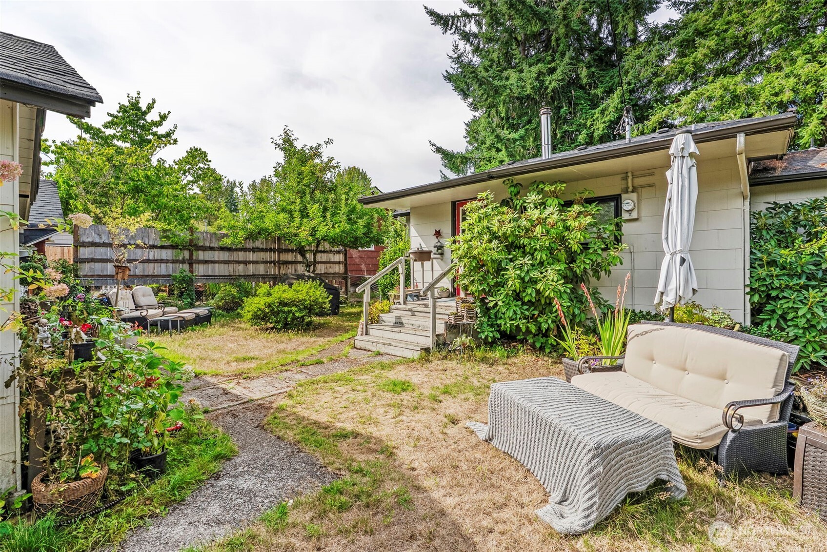 110 Madison Street Ryderwood, WA 98581 - Photo 18 of 30 a view of a chair and table in the backyard