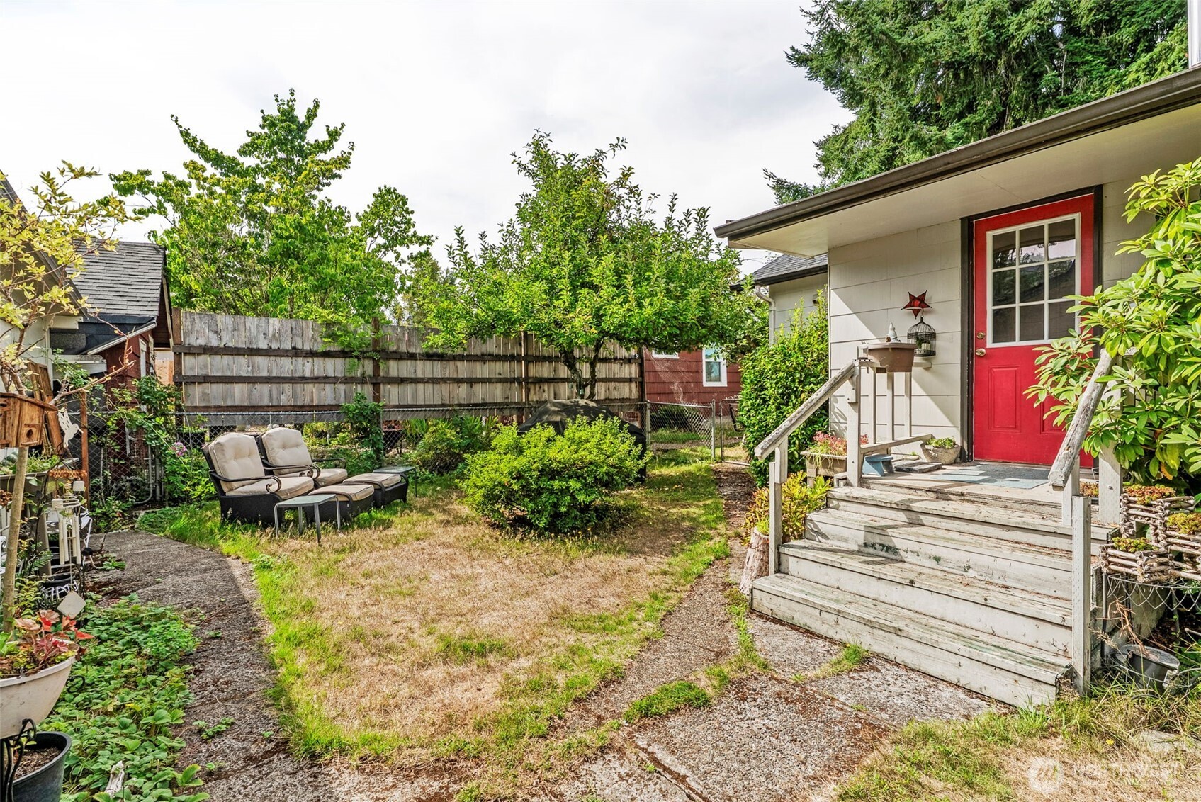 110 Madison Street Ryderwood, WA 98581 - Photo 19 of 30 a view of a chair and table in backyard of the house