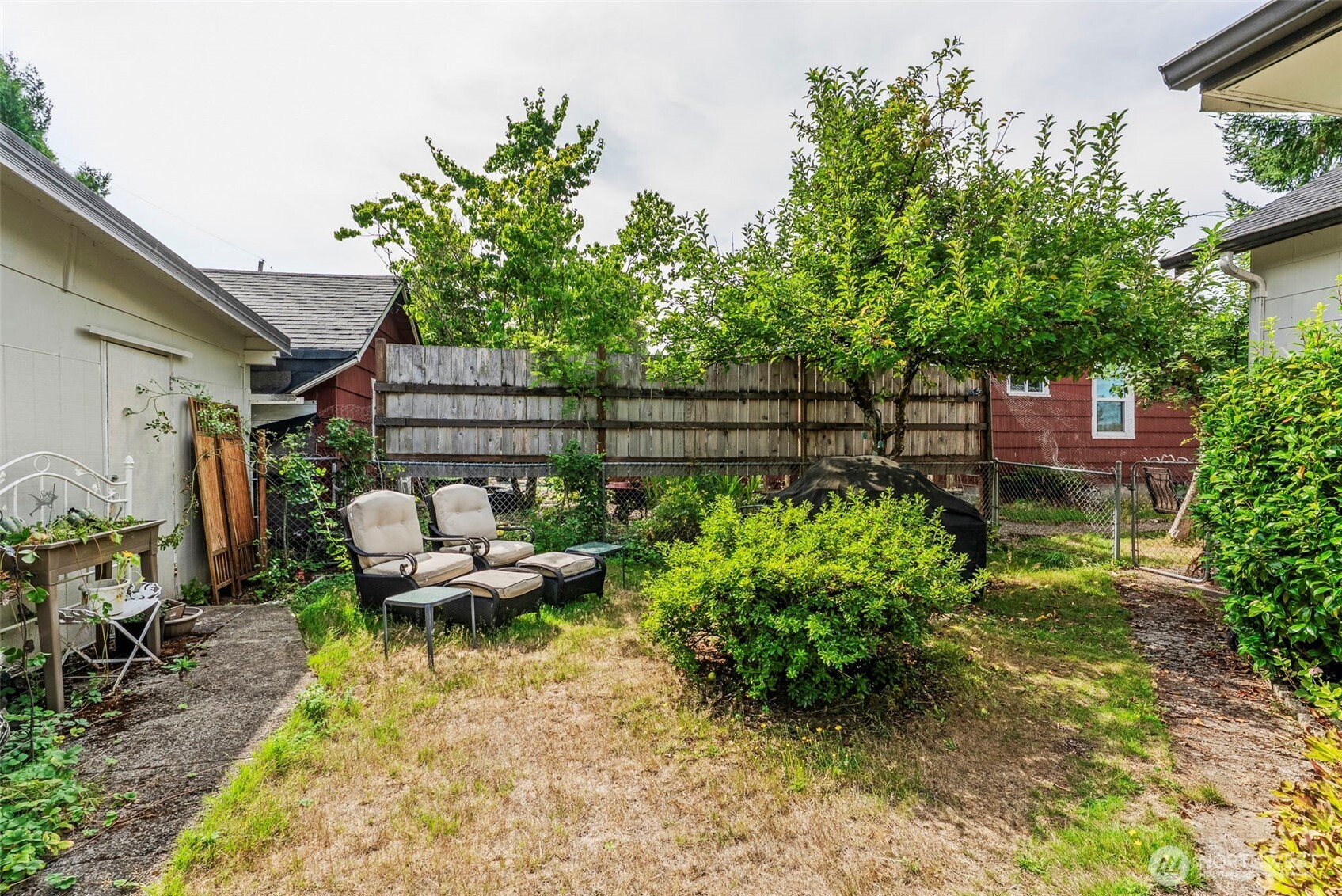110 Madison Street Ryderwood, WA 98581 - Photo 20 of 30 a backyard of a house with outdoor seating