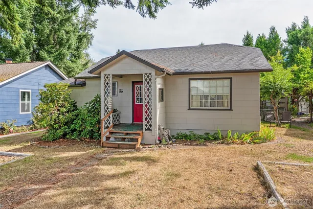 a house with trees in the background