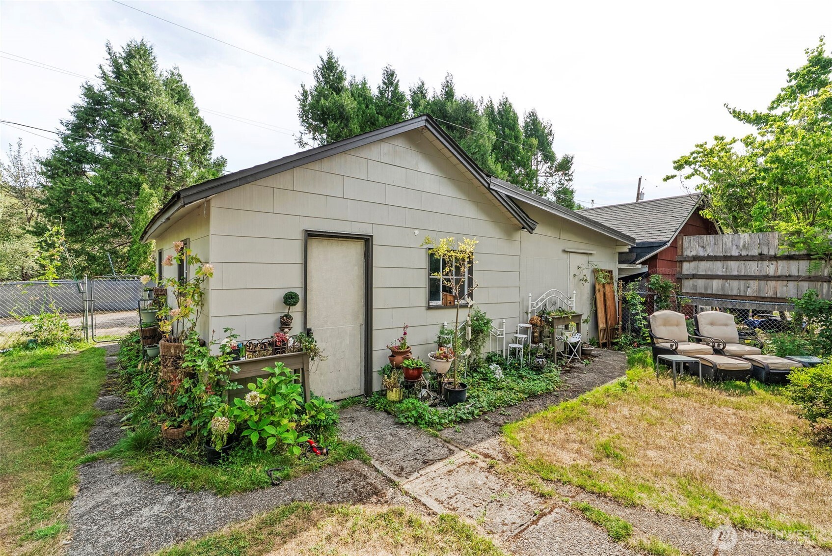 110 Madison Street Ryderwood, WA 98581 - Photo 21 of 30 a view of a house with backyard and sitting area