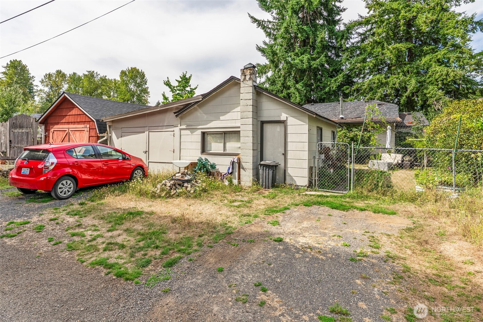 110 Madison Street Ryderwood, WA 98581 - Photo 22 of 30 a backyard of a house with table and chairs