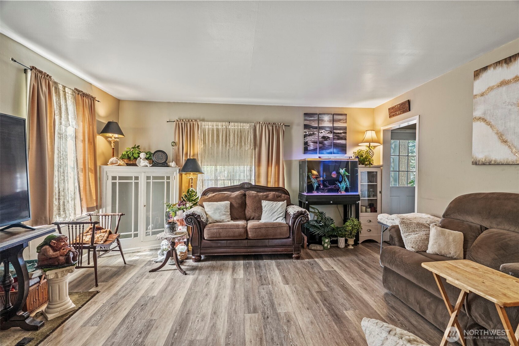 110 Madison Street Ryderwood, WA 98581 - Photo 24 of 30 a living room with furniture and a flat screen tv