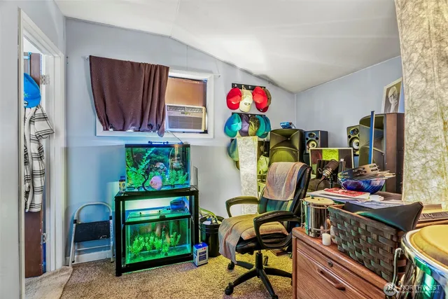 a view of room with fridge and workspace