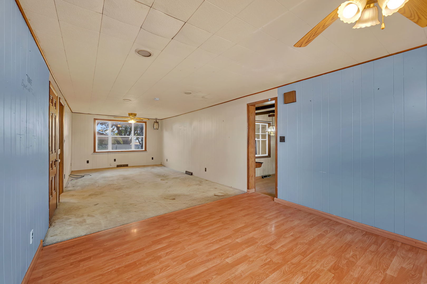 1636 North 4012th Road Earlville, IL 60518 - Photo 11 of 31 a view of a big room with wooden floor and windows
