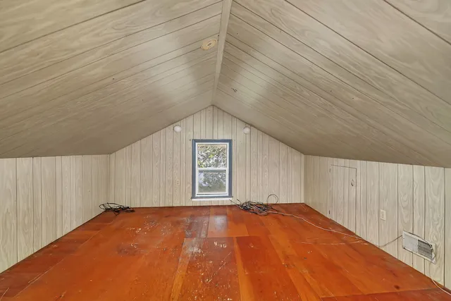 a view of a big room with windows and cabinet