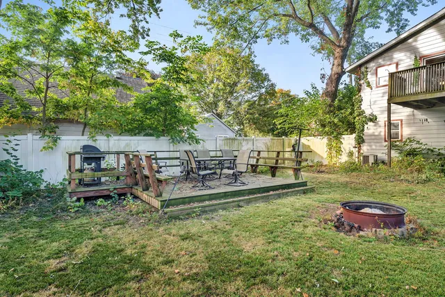 a view of a house with backyard porch and sitting area