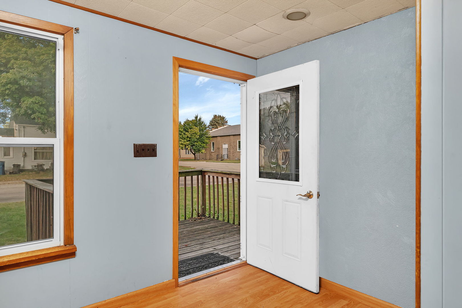 1636 North 4012th Road Earlville, IL 60518 - Photo 4 of 31 a view of a hallway with wooden floor and a living room