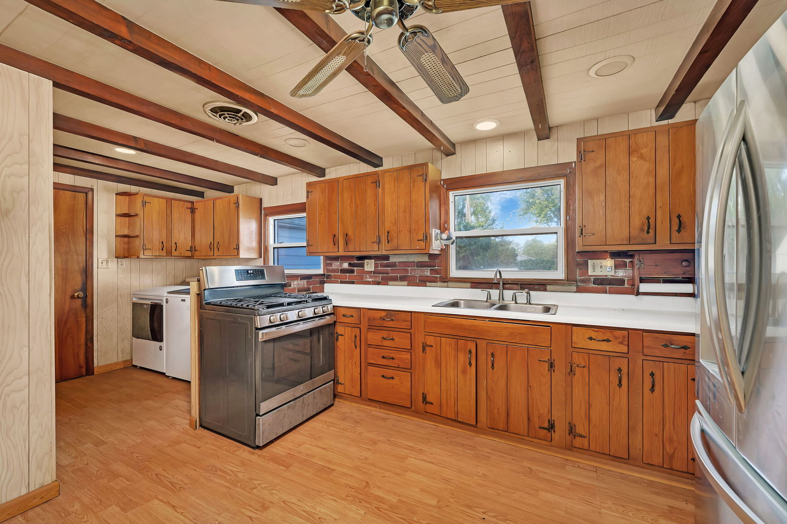 1636 North 4012th Road Earlville, IL 60518 - Photo 5 of 31 a kitchen with stainless steel appliances granite countertop a stove a sink dishwasher and a refrigerator