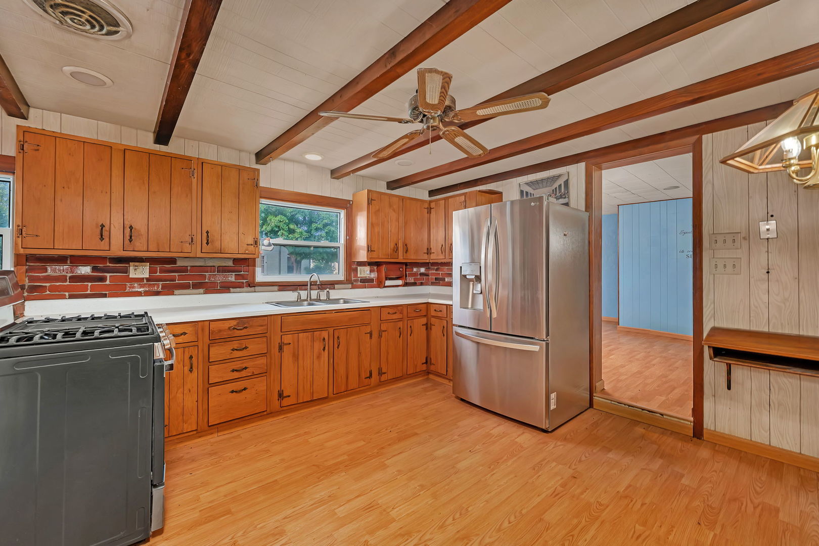 1636 North 4012th Road Earlville, IL 60518 - Photo 6 of 31 a kitchen with stainless steel appliances granite countertop a refrigerator a oven a sink with dishwasher and wooden cabinets