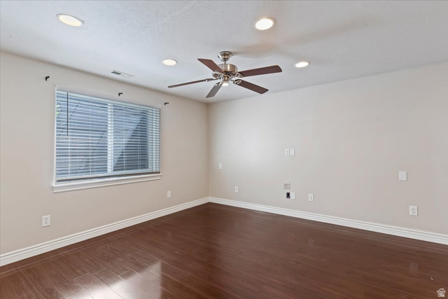 2350 South Highway 89, Unit 4 Perry, UT 84302 - Photo 10 of 30 Empty room featuring dark wood-style flooring, a ceiling fan, and recessed lighting