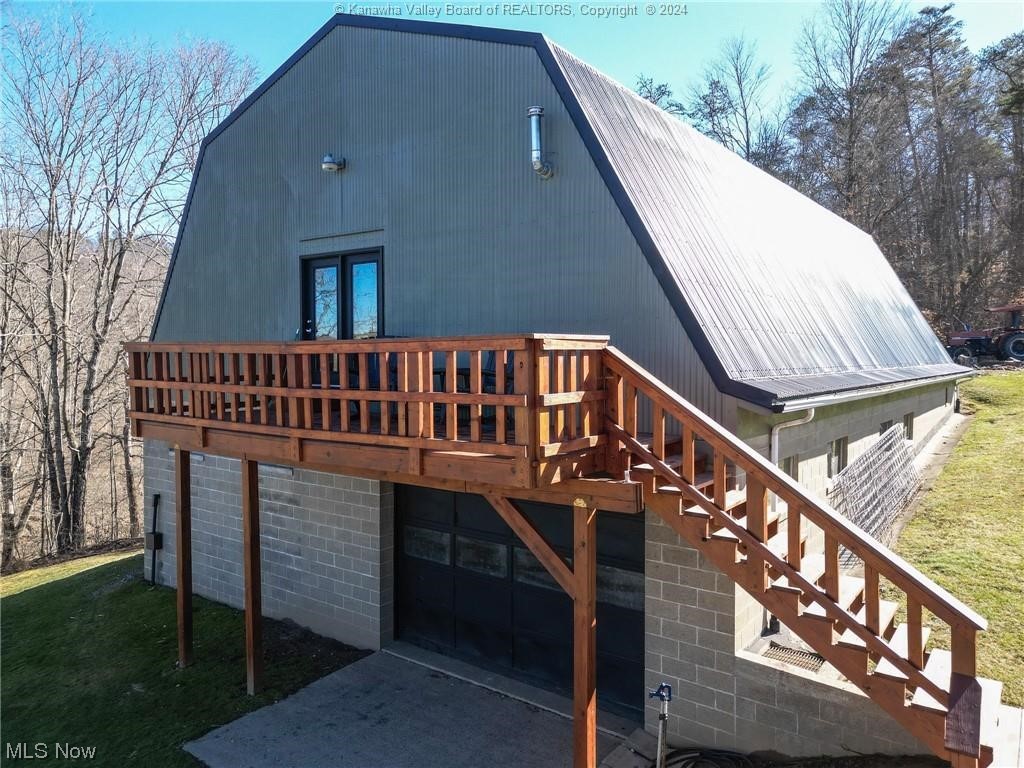 3593 Loomis Ridge Road Parkersburg, WV 26104 - Photo 27 of 41 View of front of property featuring a wooden deck and a front yard