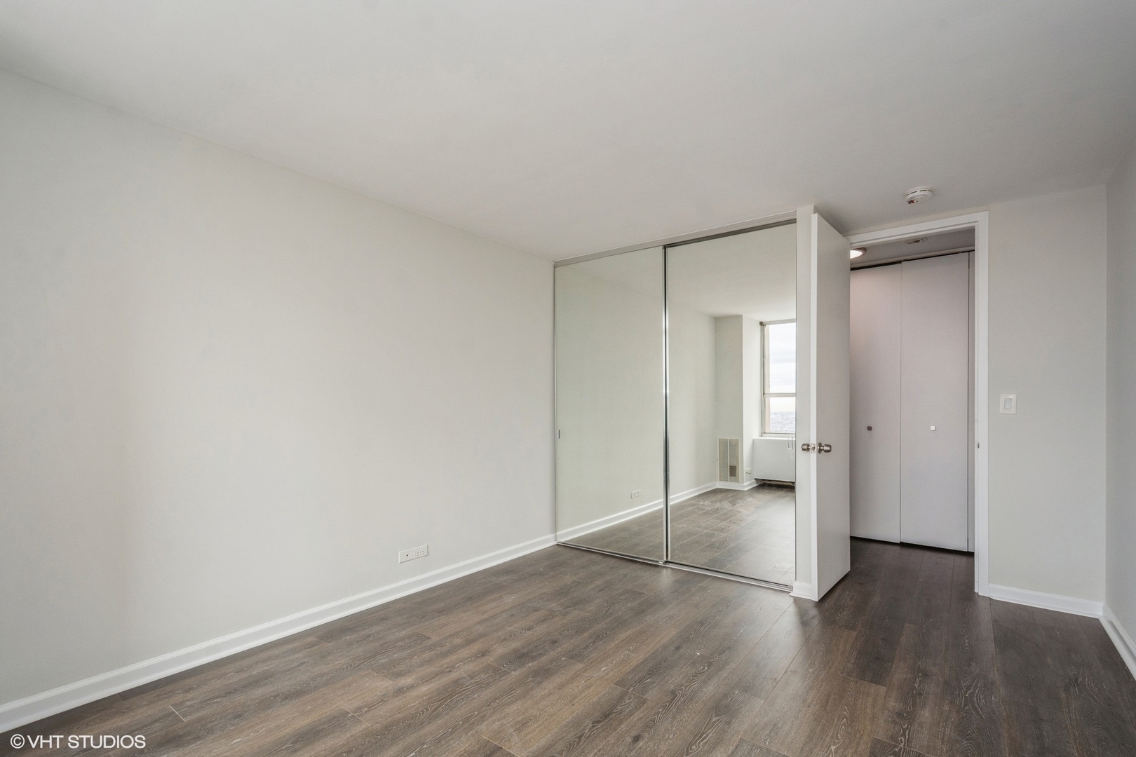 655 West Irving Park Road, Unit 5511 Chicago, IL 60613 - Photo 10 of 29 a view of wooden floor in an empty room