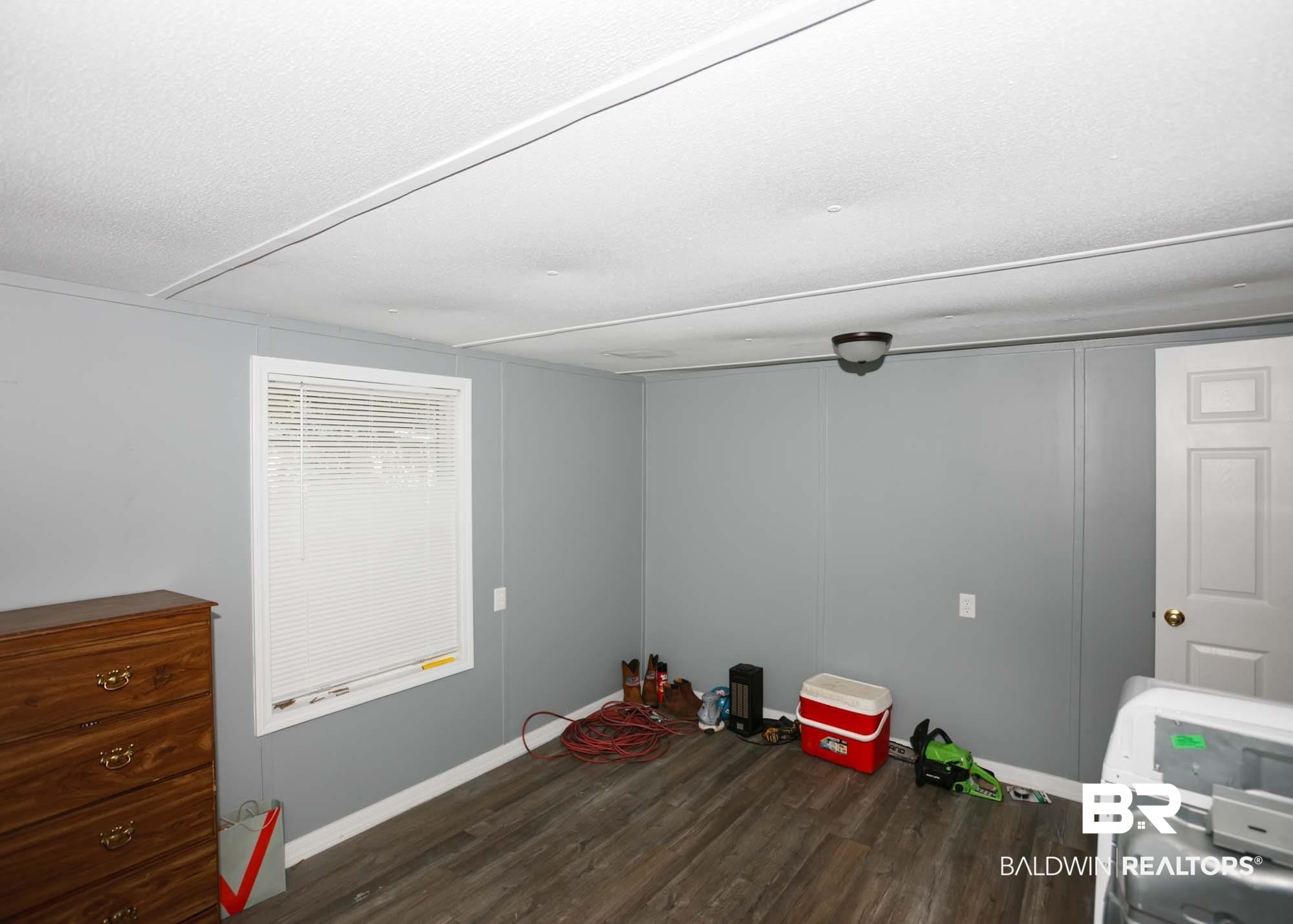 11998 Workman Avenue Foley, AL 36535 - Photo 28 of 59 Spare room featuring wood finished floors and baseboards
