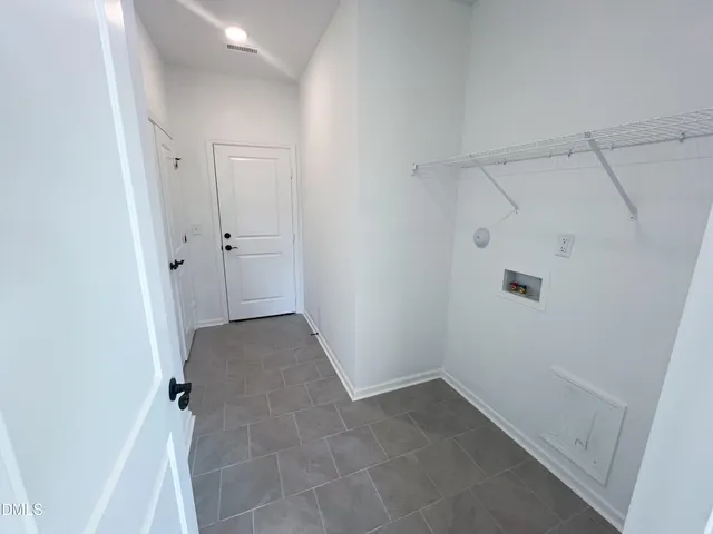 a view of a lake view with a large tree in the background