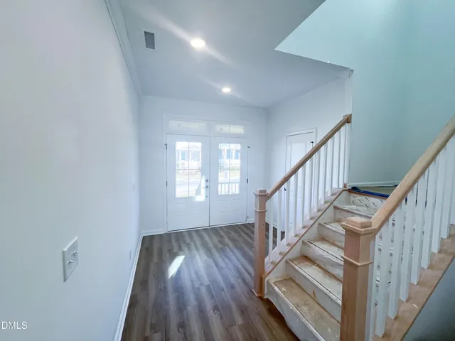 a front view of a house with a yard table and chairs