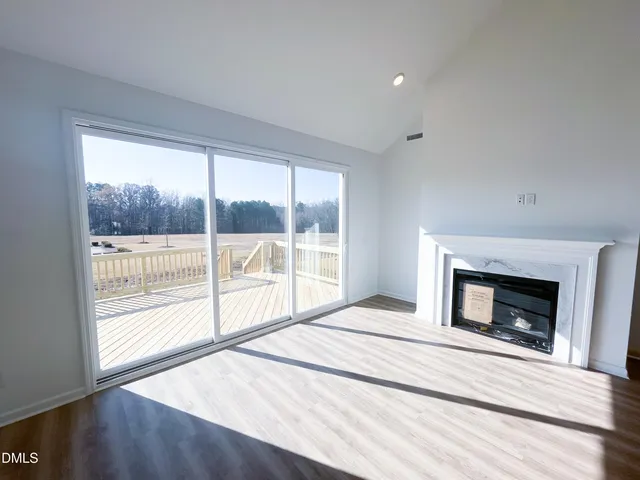 a view of balcony with wooden floor and lake view