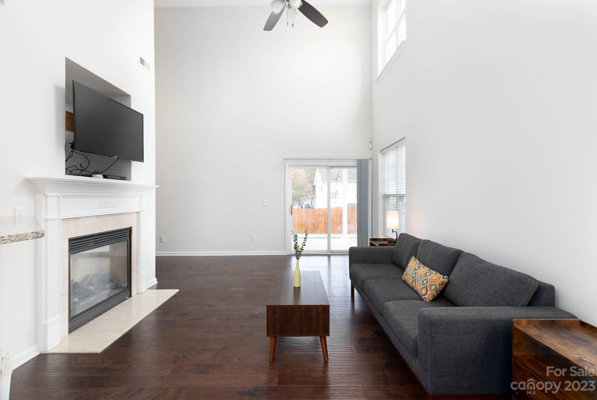 2921 Sedona Place Fort Mill, SC 29708 - Photo 6 of 31 a living room with furniture and a fireplace