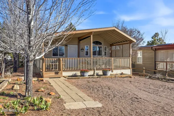 a front view of a house with a outdoor space