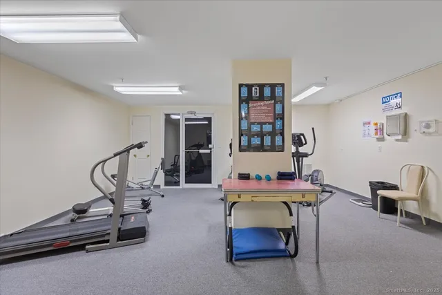 a room with gym equipment and gym equipment
