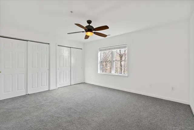 a view of room with a ceiling fan