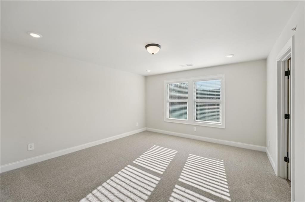 6440 Pinin Place Cumming, GA 30041 - Photo 39 of 52 a view of an empty room with a window