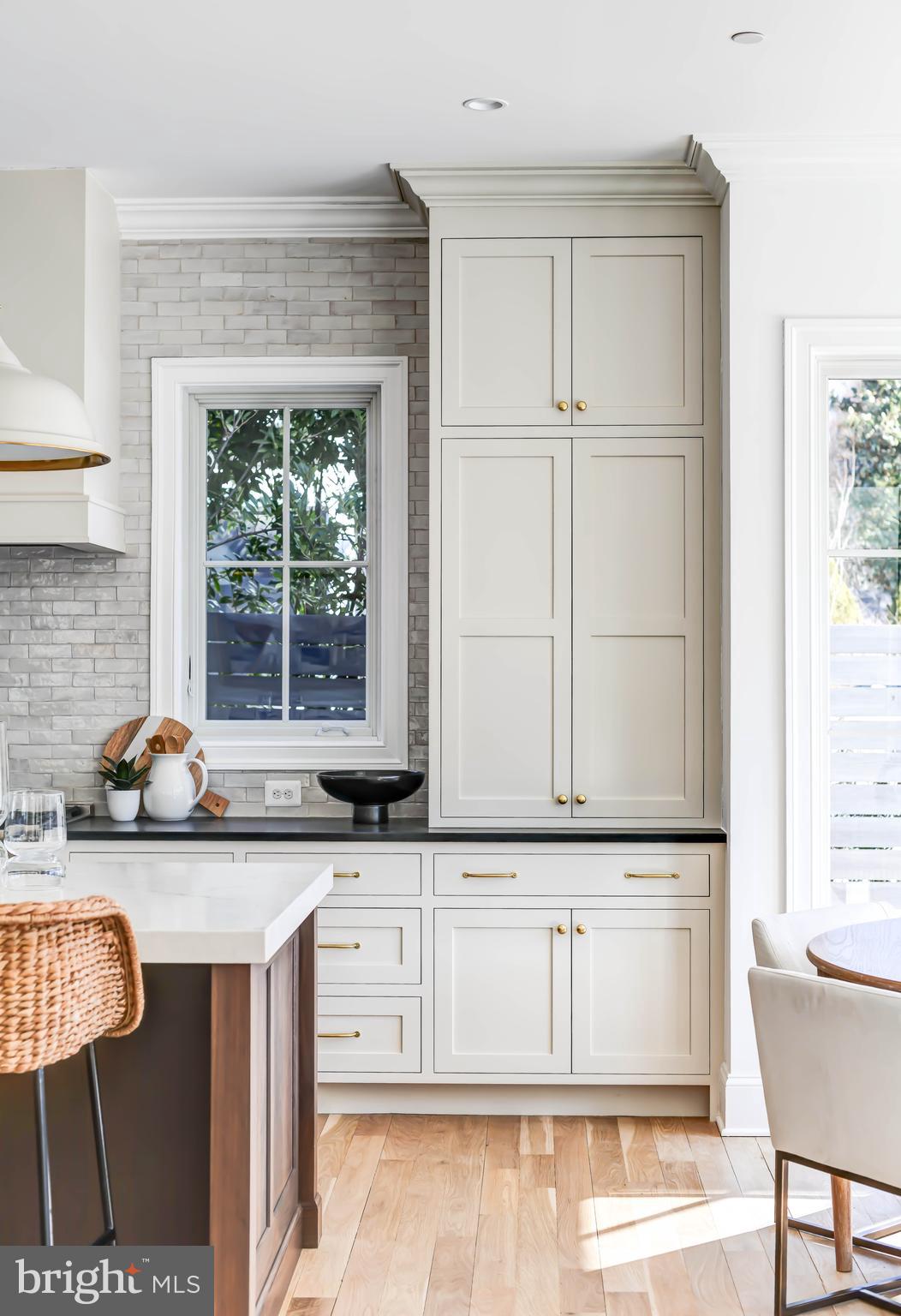 4422 Walsh Street Chevy Chase, MD 20815 - Photo 20 of 93 a kitchen with granite countertop a sink a counter space and cabinets