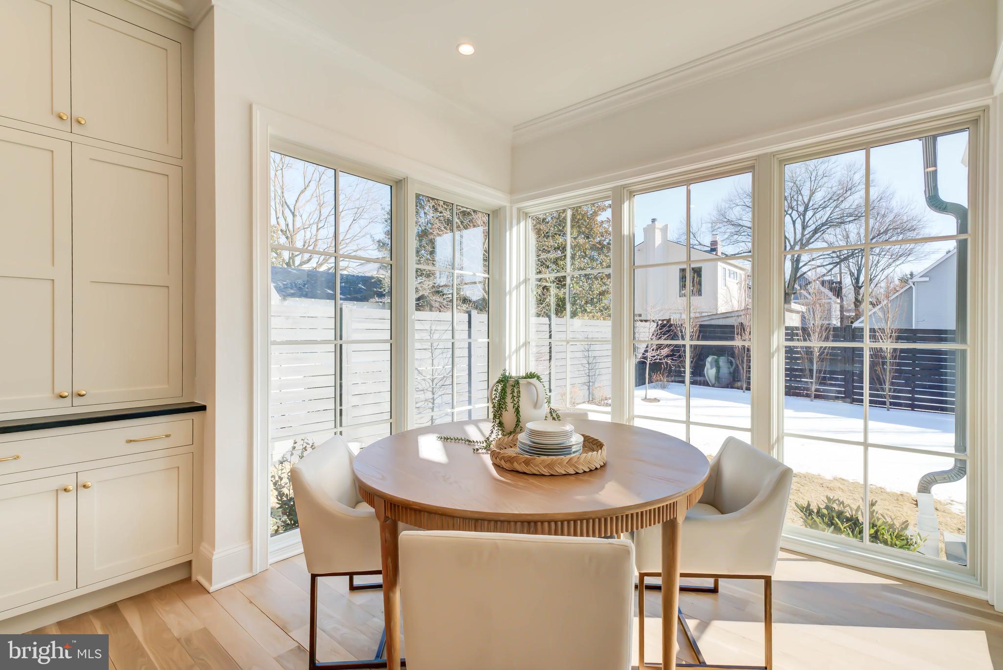 4422 Walsh Street Chevy Chase, MD 20815 - Photo 27 of 93 a view of a dining room with furniture window and wooden floor