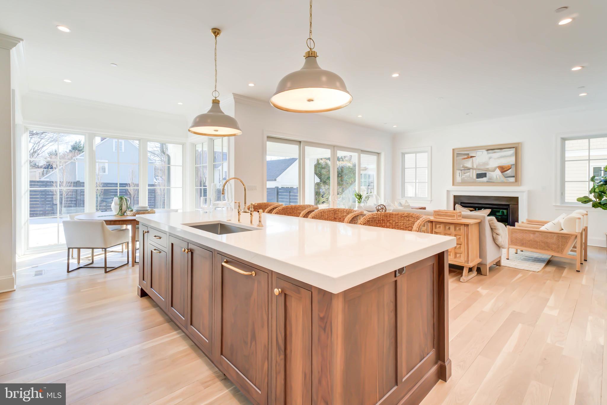 4422 Walsh Street Chevy Chase, MD 20815 - Photo 30 of 93 a large kitchen with kitchen island a large island in it