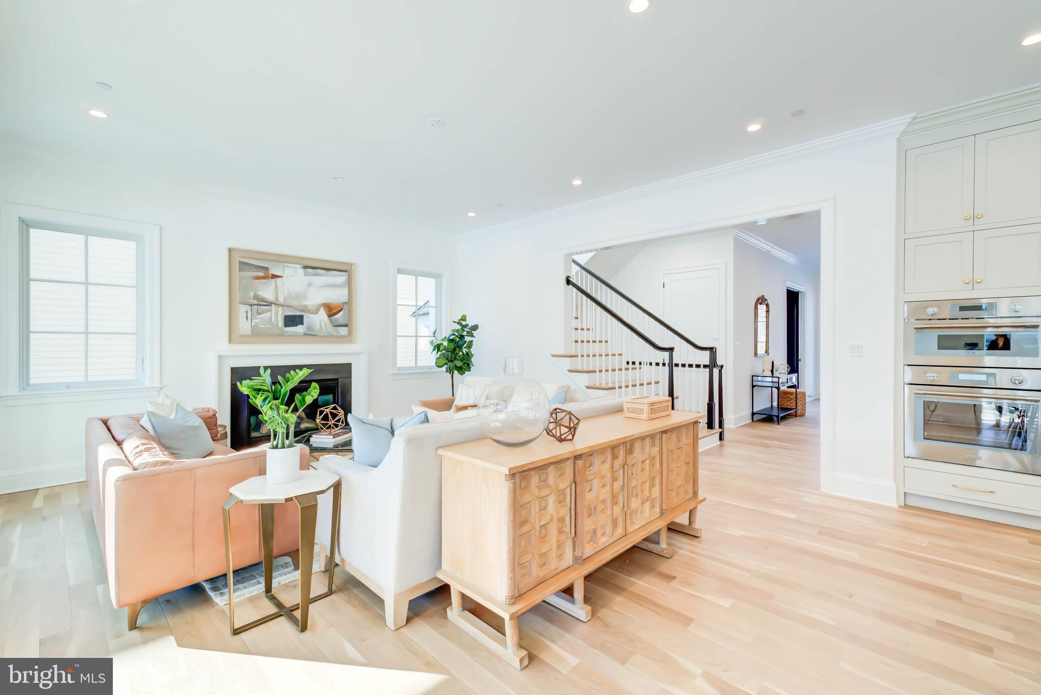 4422 Walsh Street Chevy Chase, MD 20815 - Photo 32 of 93 a living room with furniture and wooden floor
