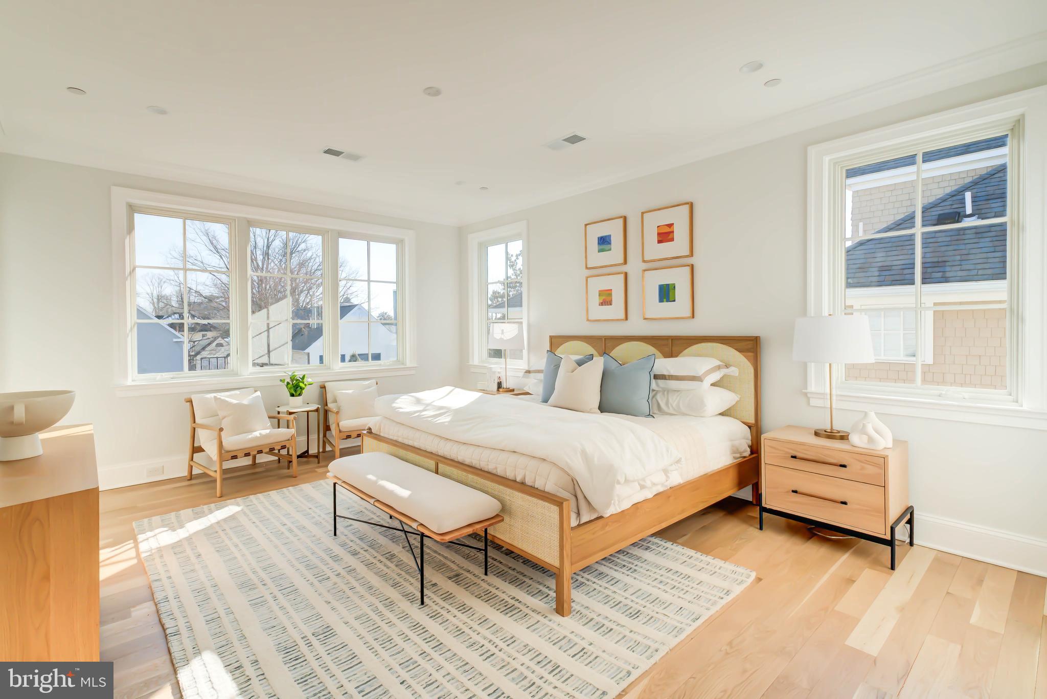 4422 Walsh Street Chevy Chase, MD 20815 - Photo 46 of 93 a spacious bedroom with a bed and a large window
