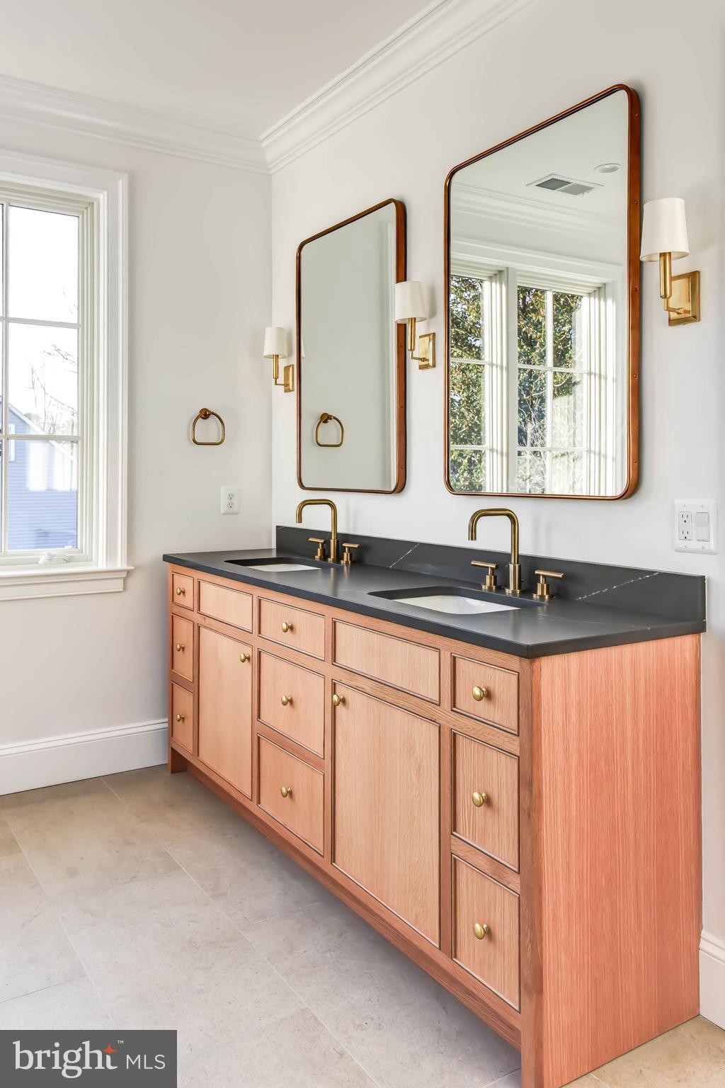 4422 Walsh Street Chevy Chase, MD 20815 - Photo 52 of 93 a bathroom with a sink double vanity and a mirror